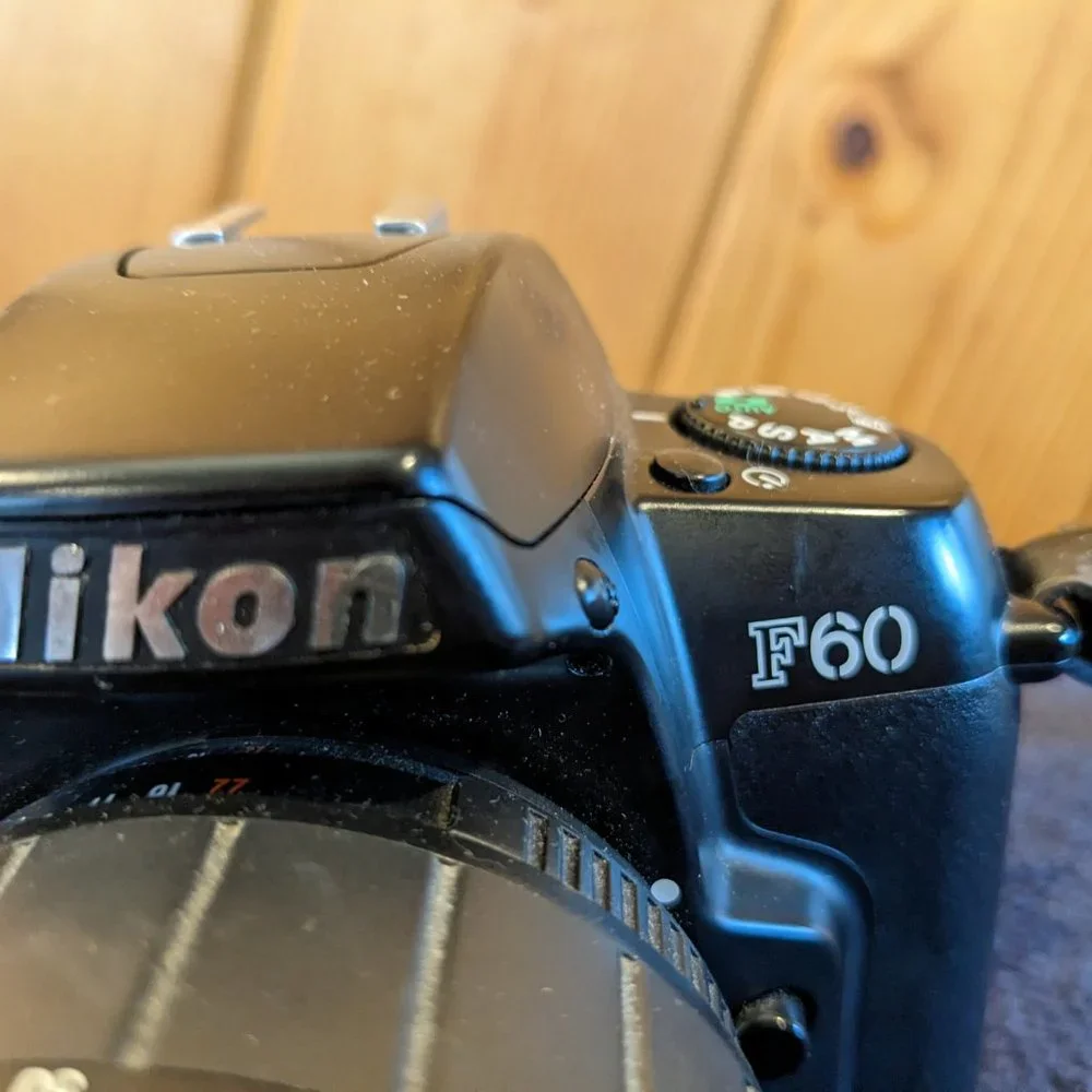 Nikon SLR F60 body for parts/repair. Lens is in great condition.